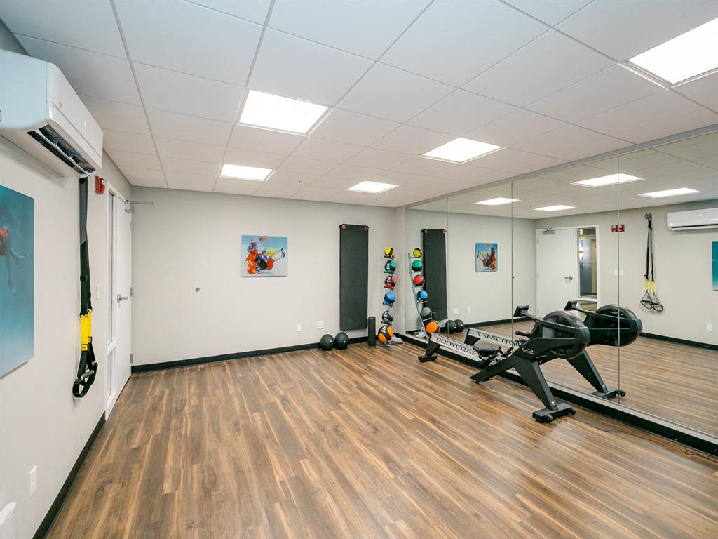 a room with a lot of exercise equipment in it