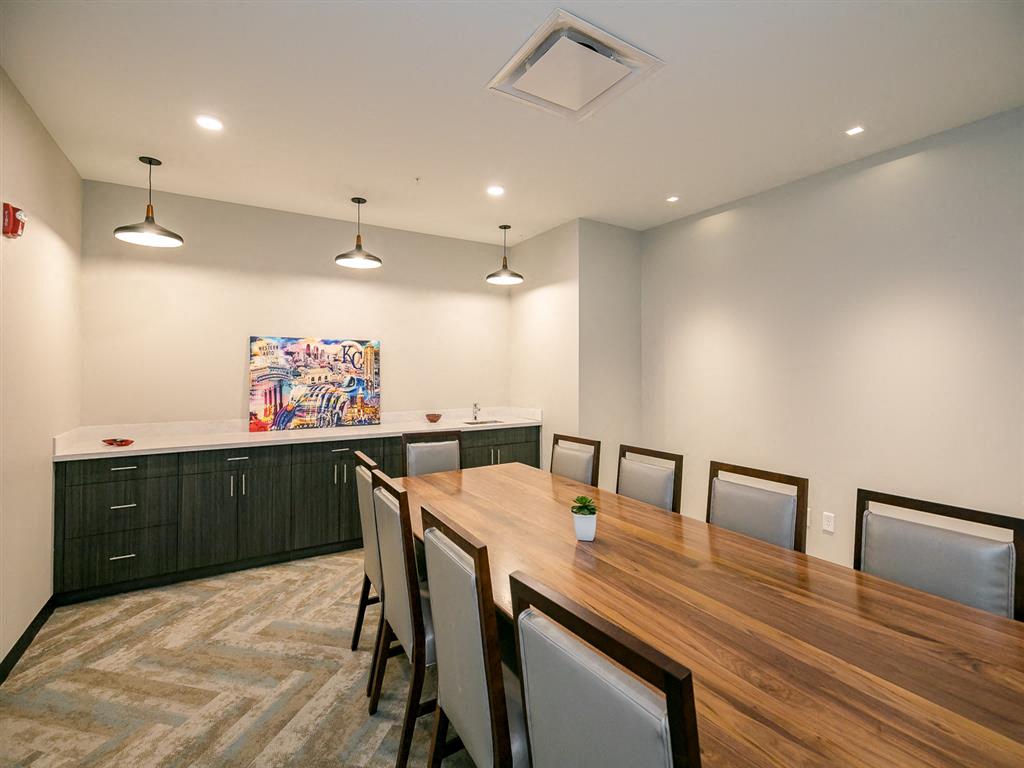 a conference room with a long table and chairs