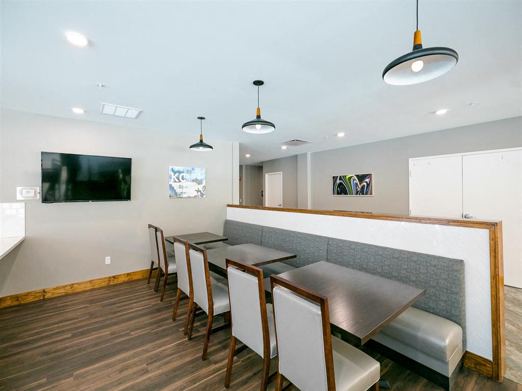 a dining room with a long table and chairs