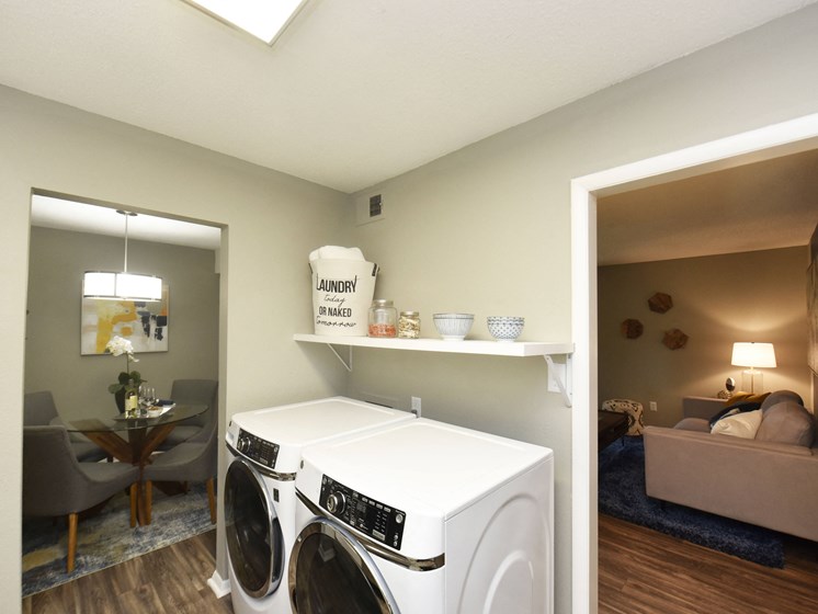 Two BR Apartments in Vestavia Hills, AL - MarQ Vestavia - Full-Size Front Load Washer and Dryer with Shelving and Hardwood-Style Flooring