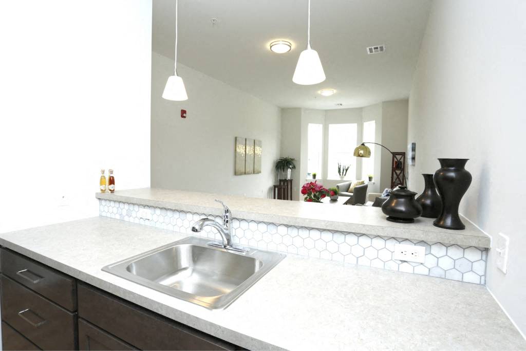 a kitchen with a sink and a counter top