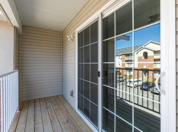 patio with sliding glass door at Quail Creek Apartments