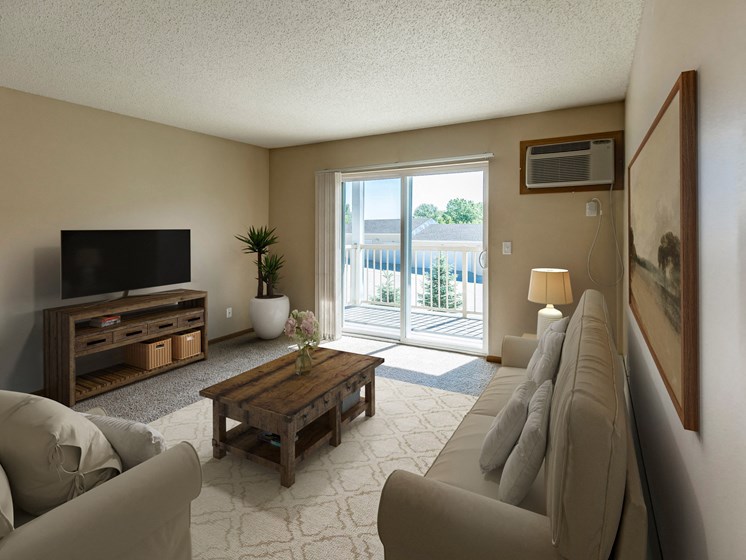 Bismarck, ND Sunset Ridge Apartments.  A living room with a couch, coffee table, tv, and a glass sliding door that brightens the room with natural light.