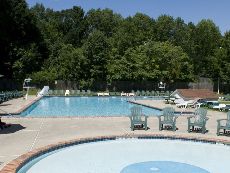 Two sparkling pools with poolside lounge at Troy Hills Village