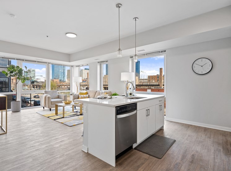Apartment kitchen and living room open floor plan at 23rd Place at Southbridge in Chicago, IL