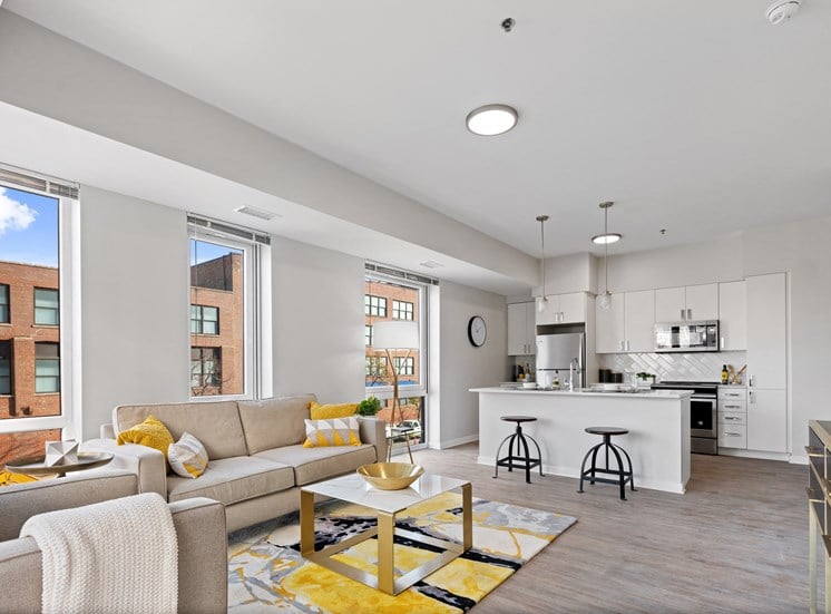 Spacious open-floor plan view living room and kitchen at 23rd Place Apartments in Chicago, IL
