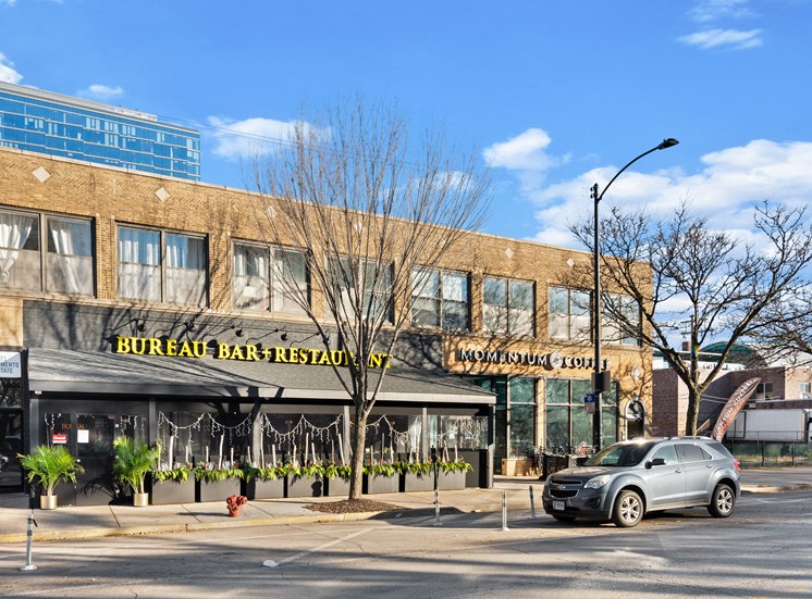 Street view of restaurant spaces near 23rd Place Apartments in Chicago, IL