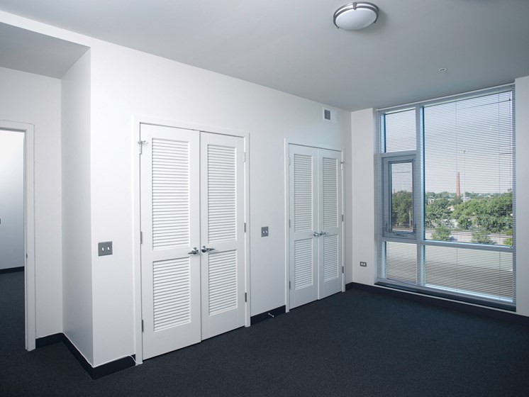 Image of Park Boulevard IIB bedroom with large window and closets.