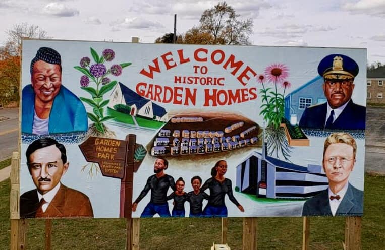 A sign welcoming visitors to Historic Garden Homes.