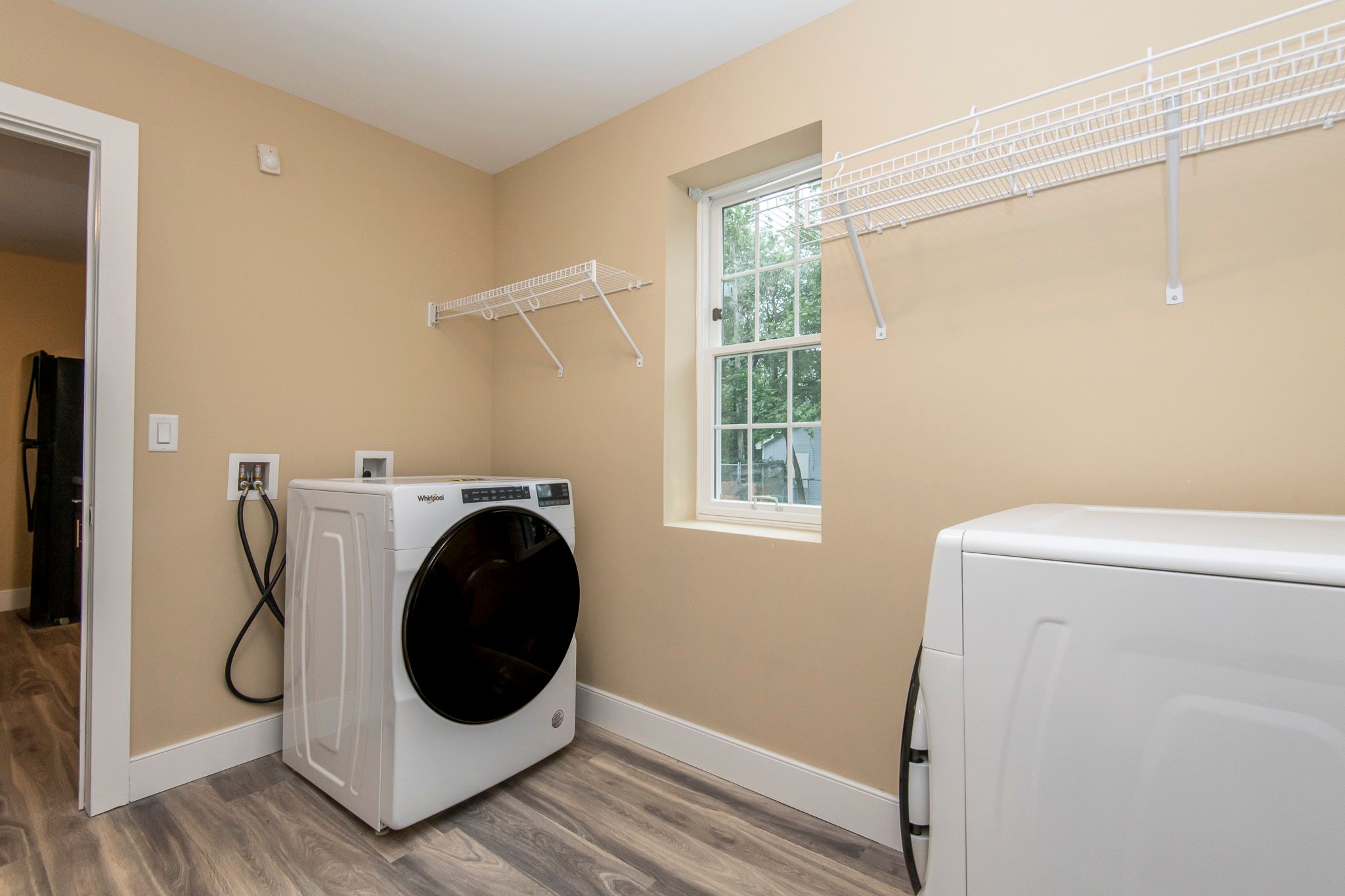 A laundry room with a washer and dryer.