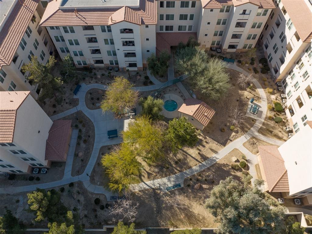 A bird's eye view of a courtyard surrounded by buildings.