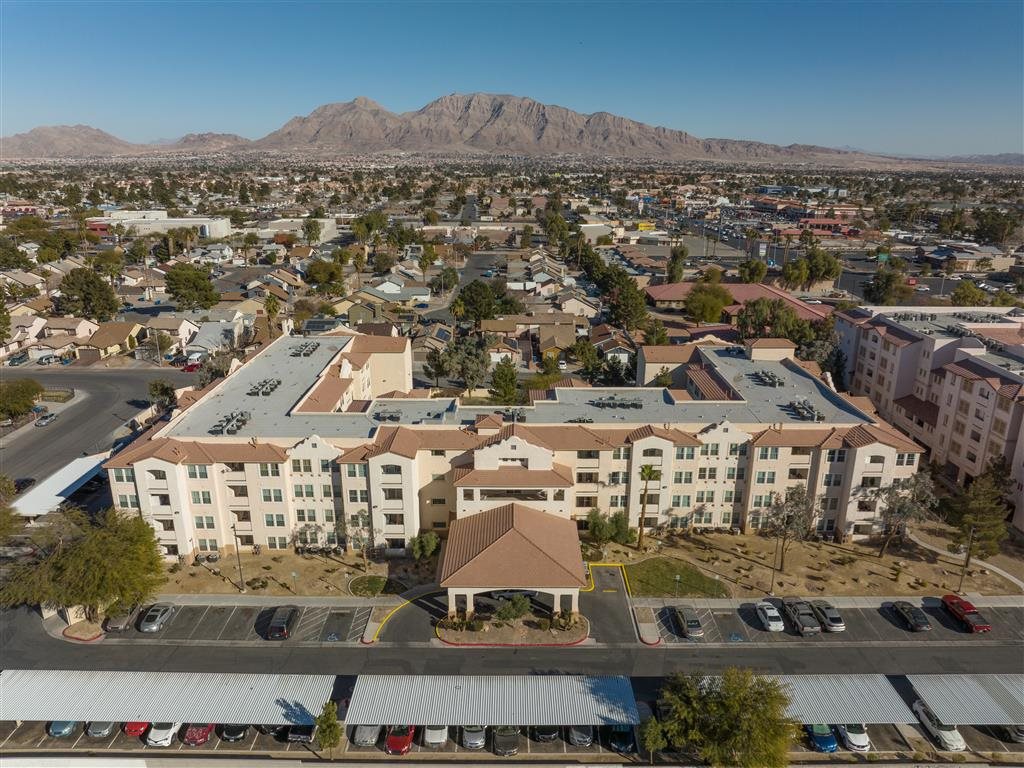 A large building with a parking lot in front of it.