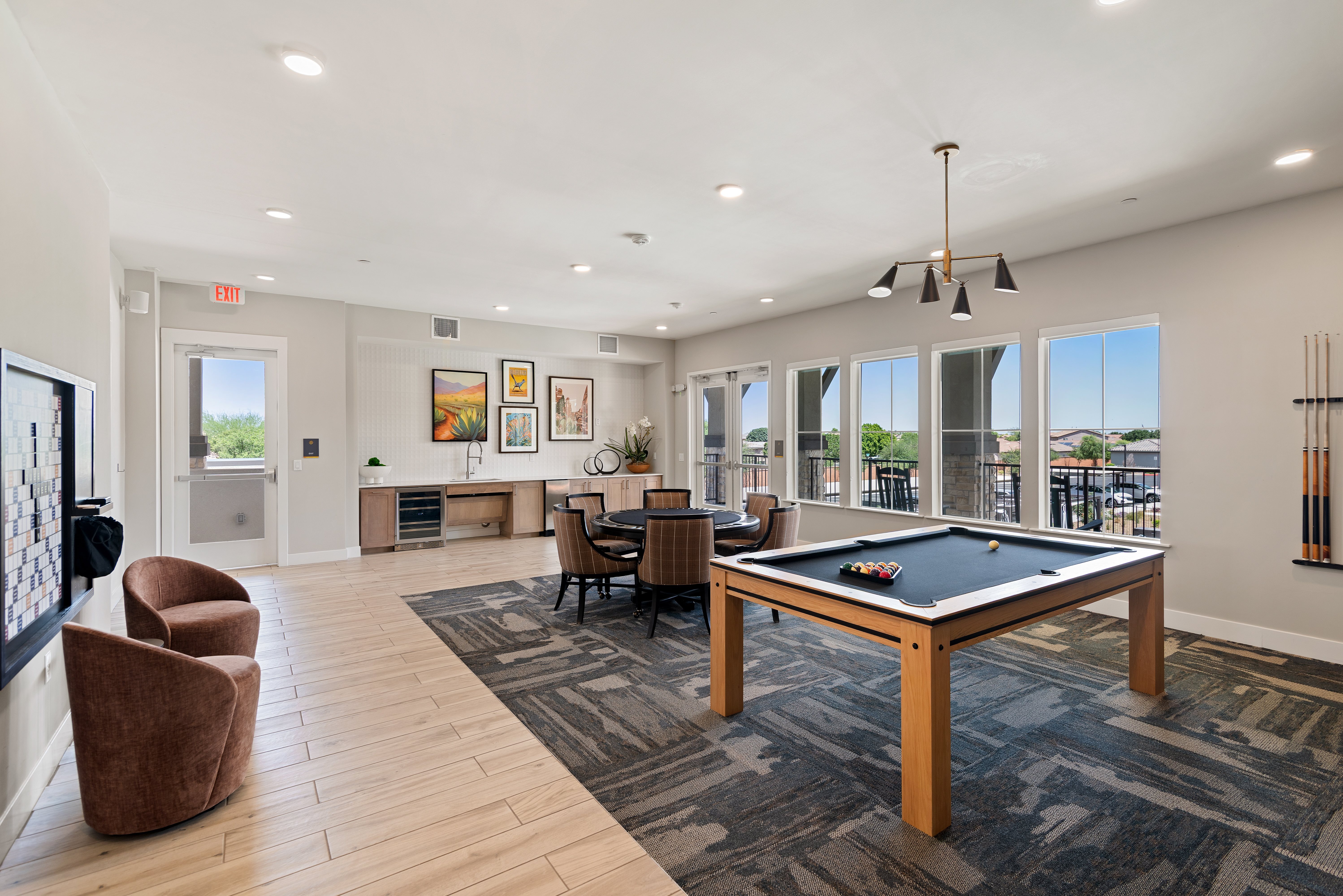 A room with a pool table and a chair.