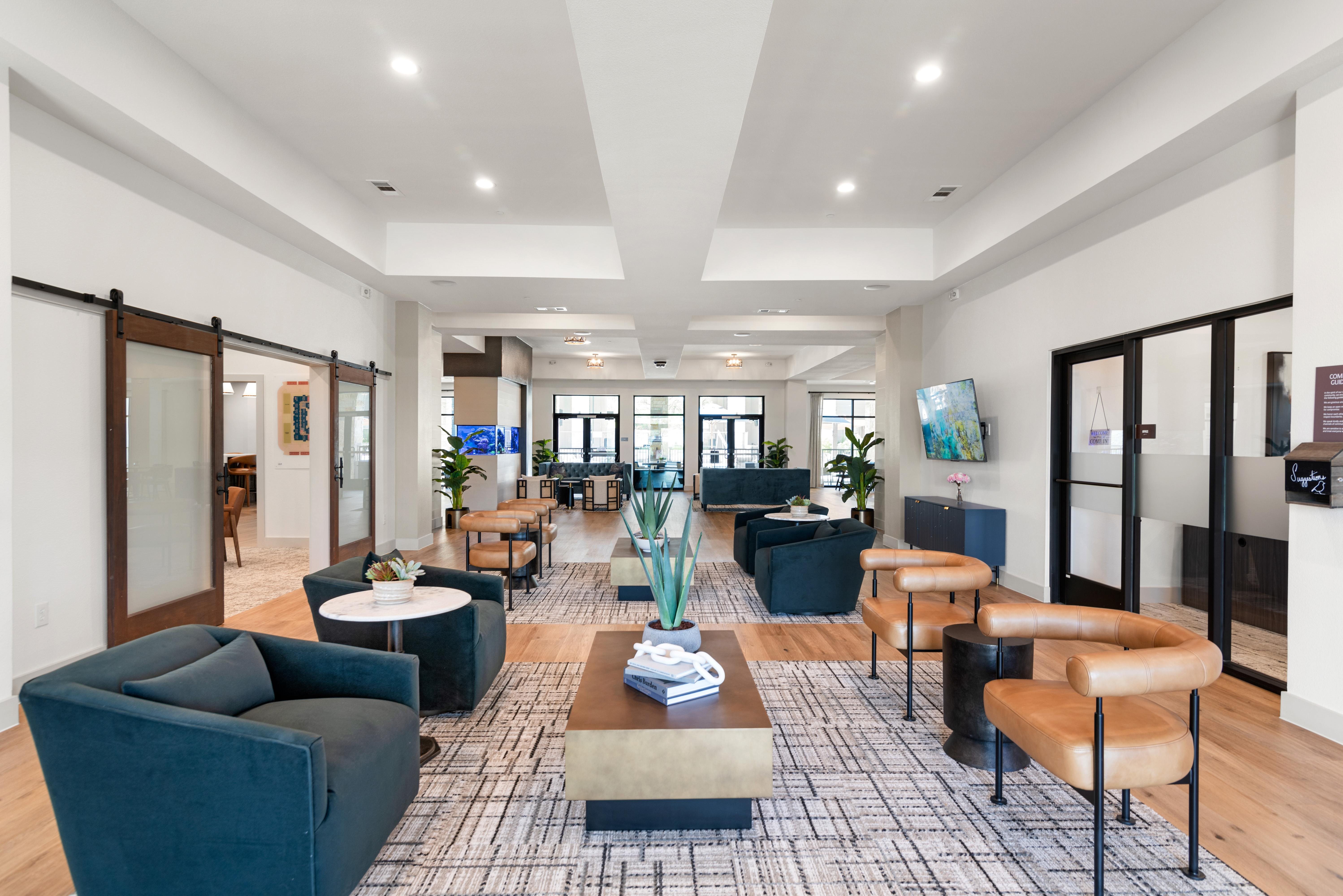 A spacious waiting area with a variety of seating options and a reception desk.