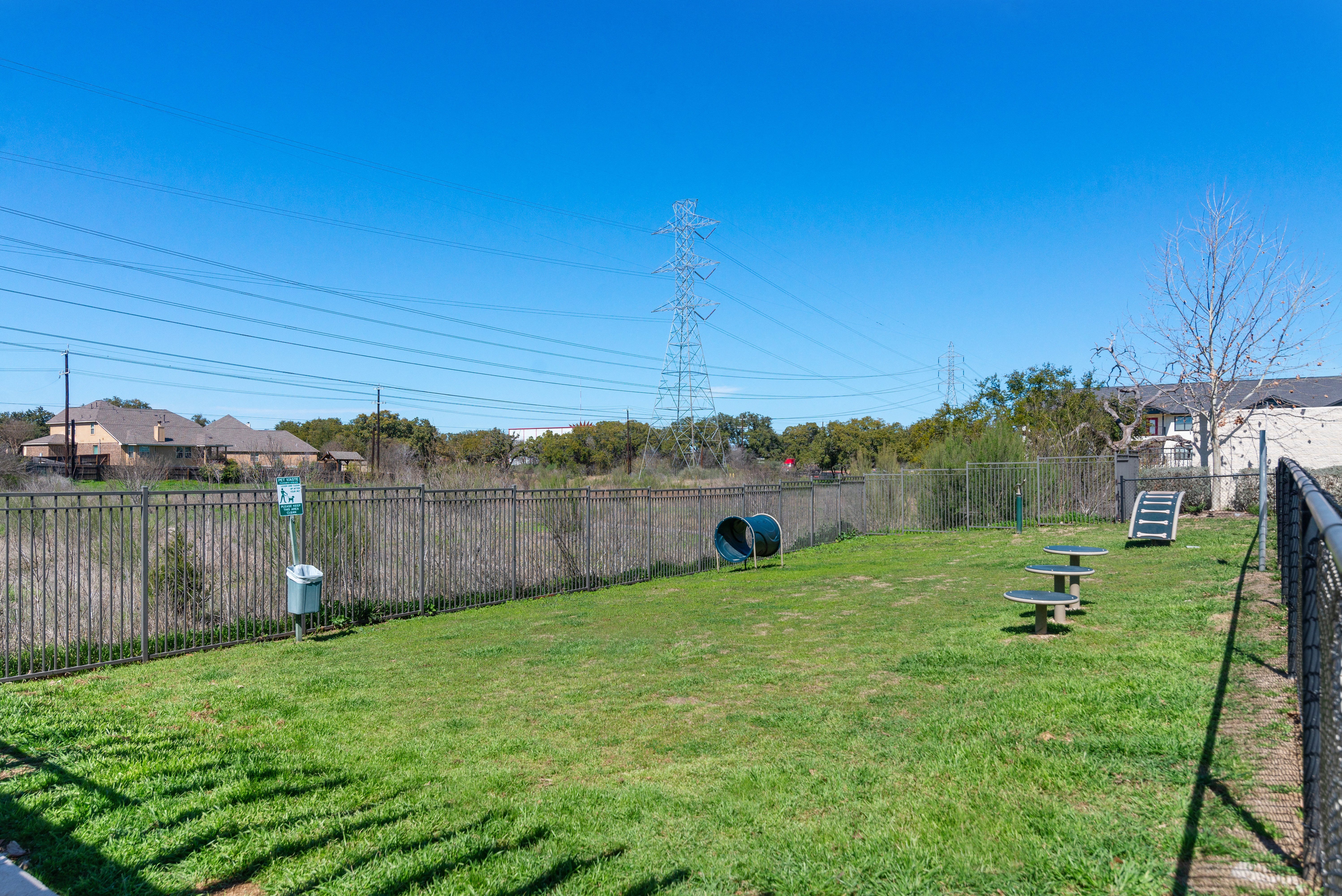 a fenced in dog park at a senior apartment community