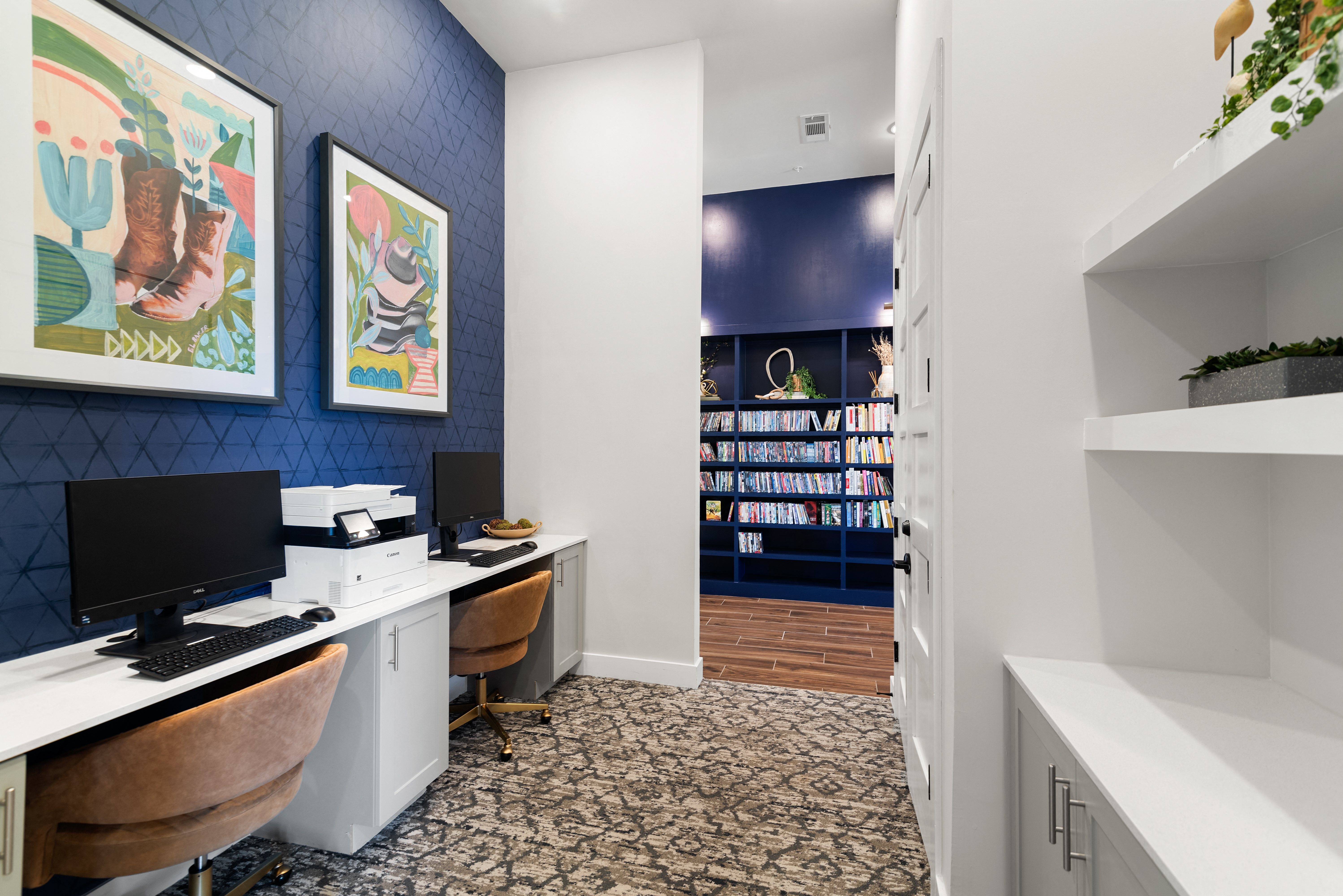 a home office with a computer desk and a bookshelf