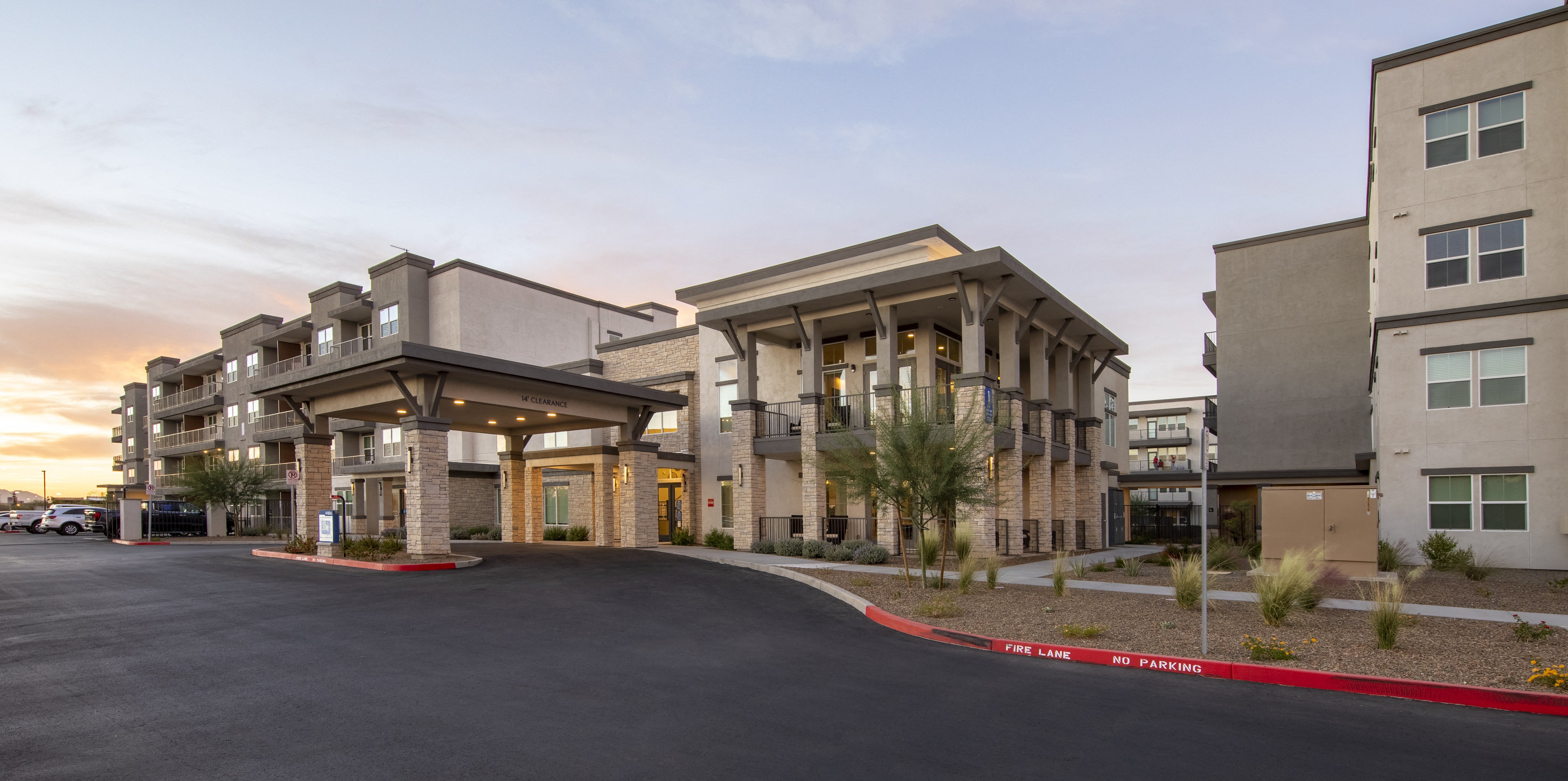 an exterior view of the entrance to a senior apartment community
