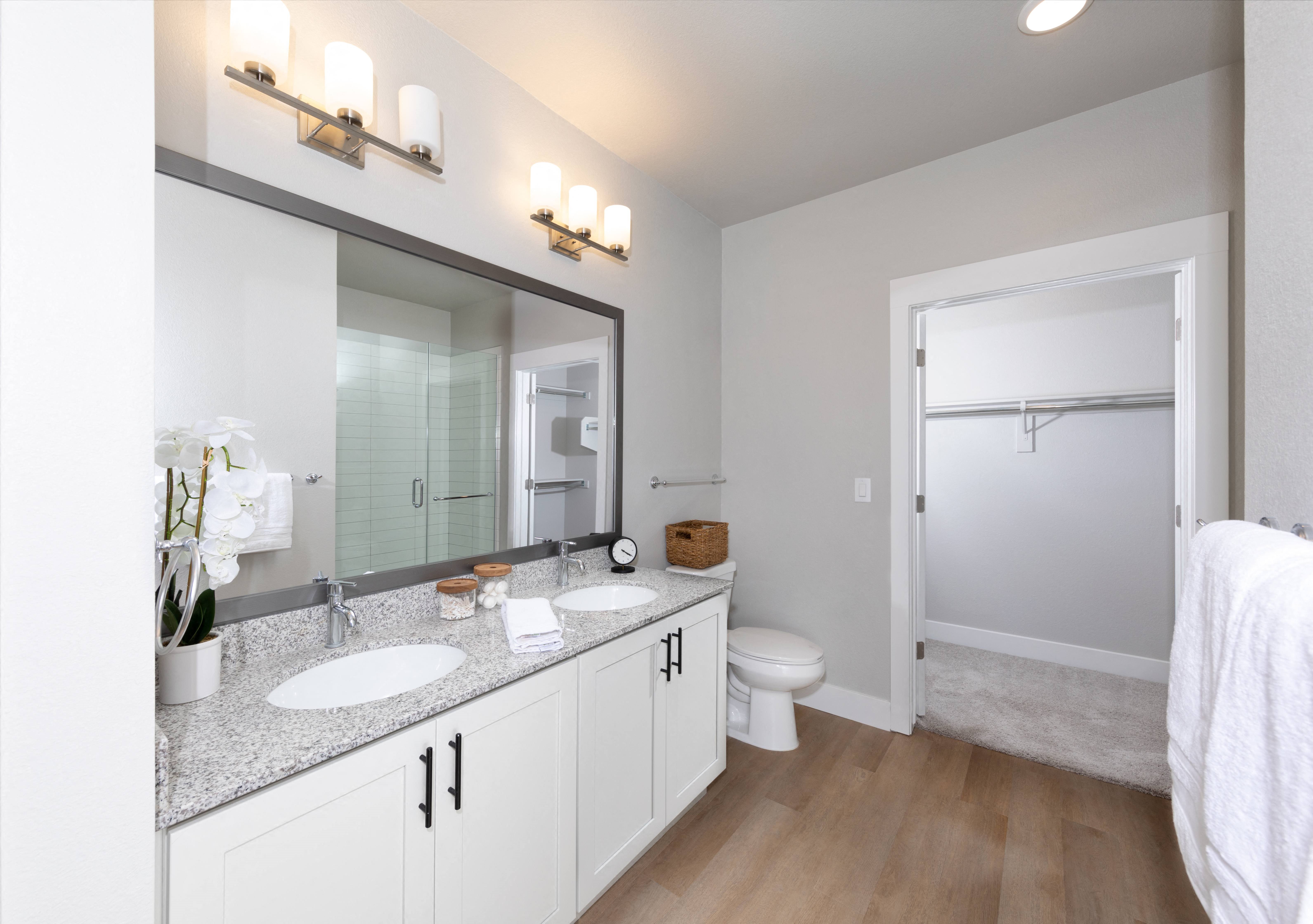 a bathroom with two sinks at a senior apartment community