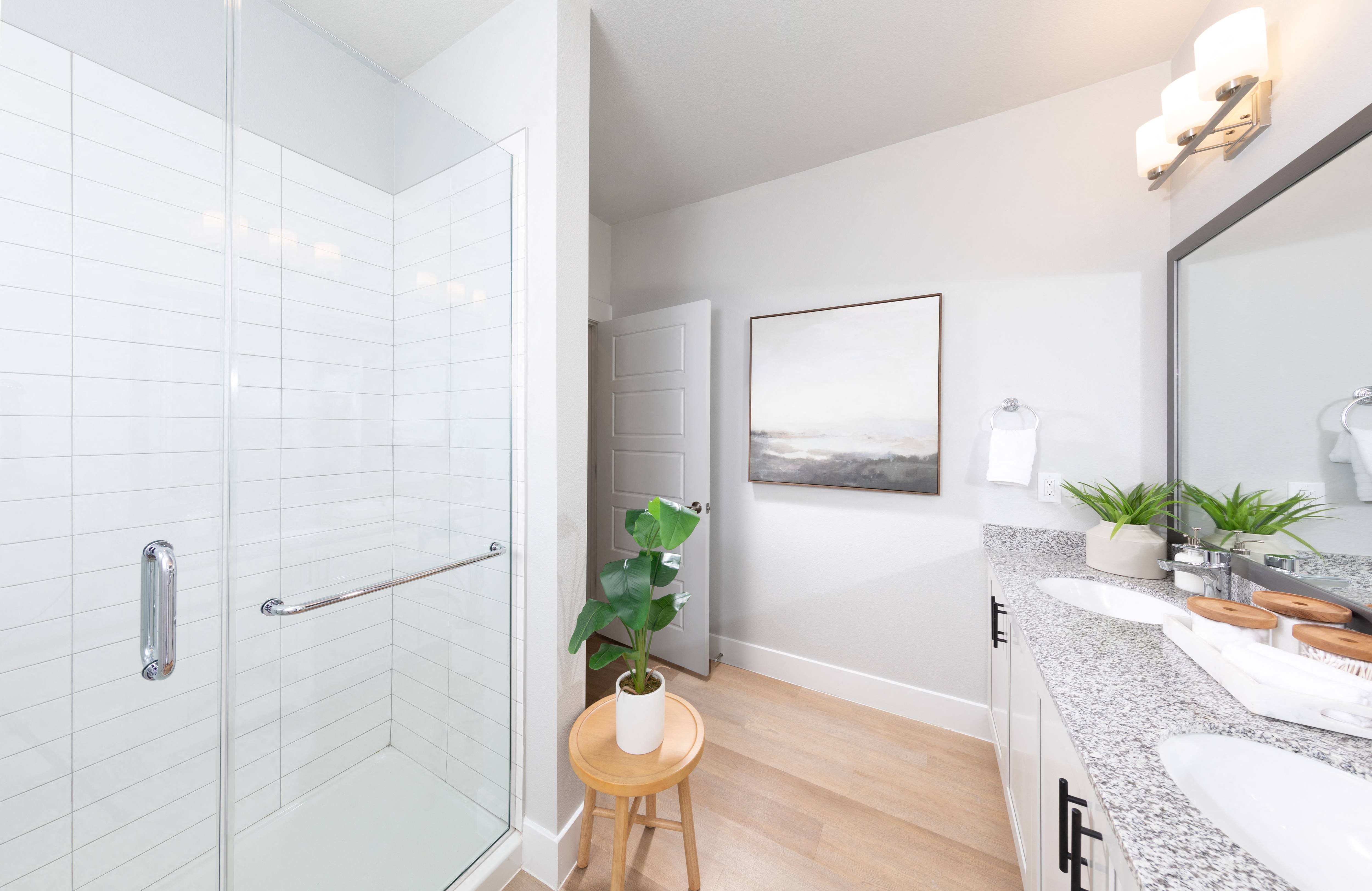a bathroom with a shower at a senior apartment community