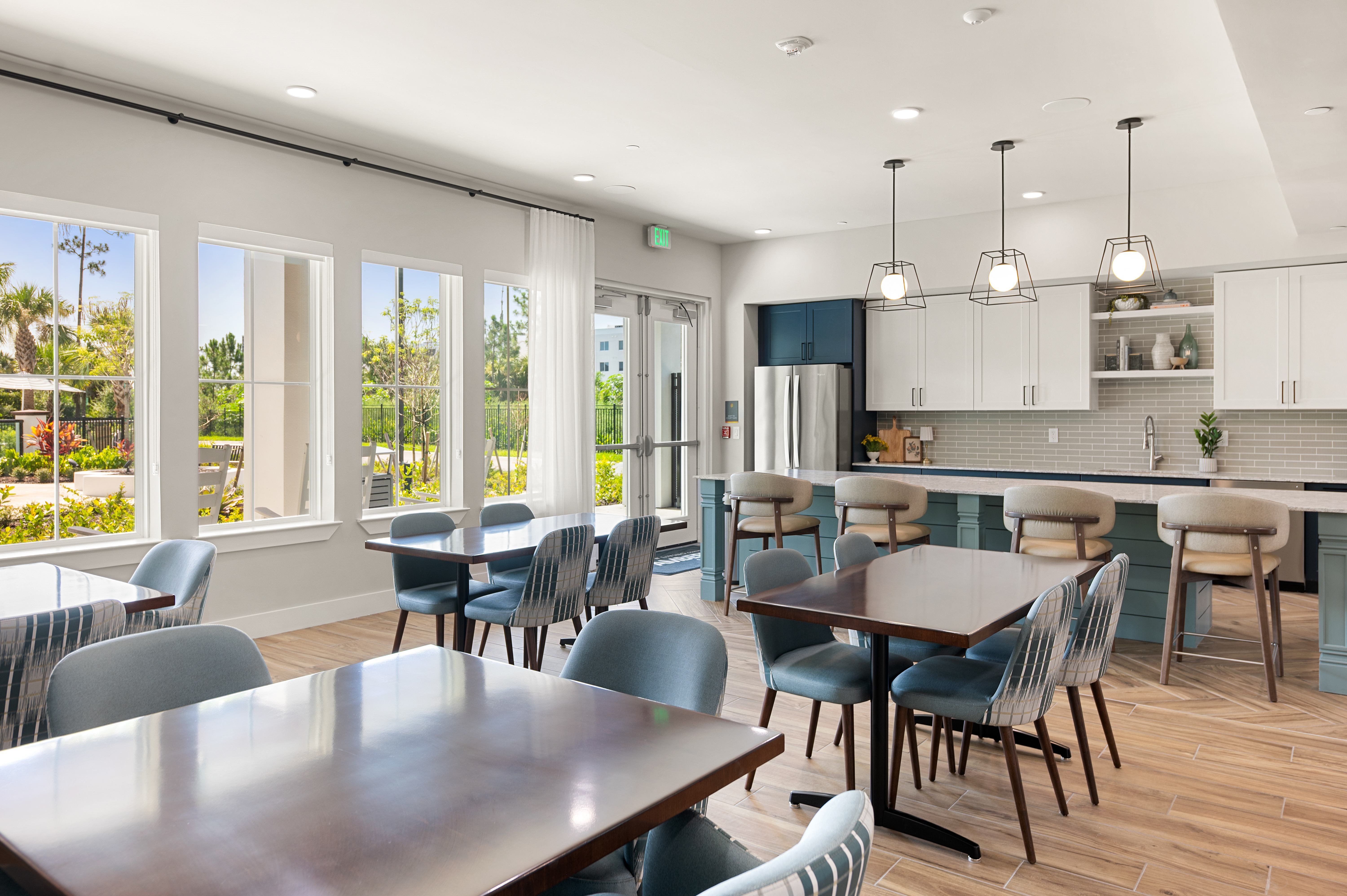 A modern kitchen and dining area with a large table and chairs.