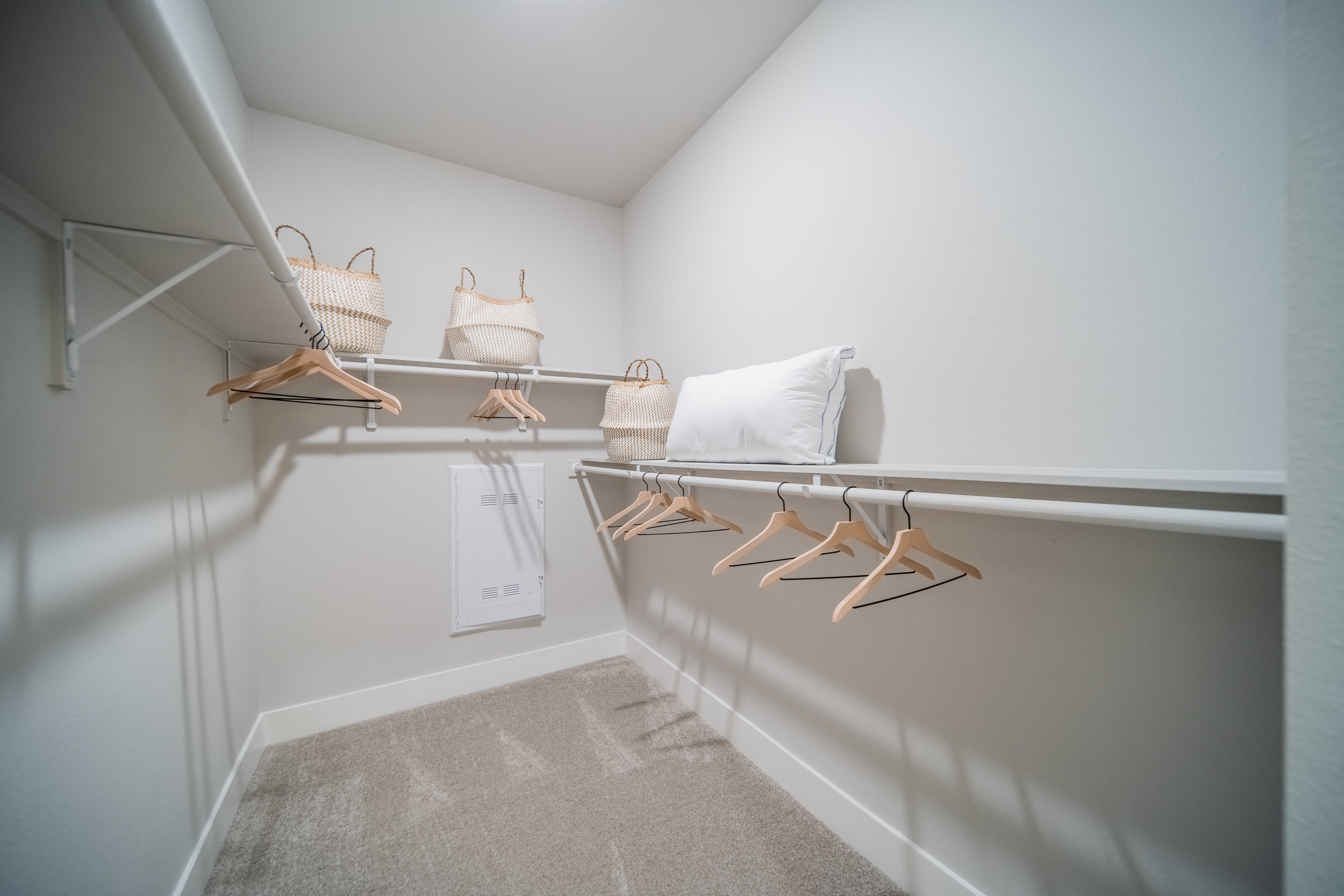 a walk-in closet with shelving at a senior apartment community