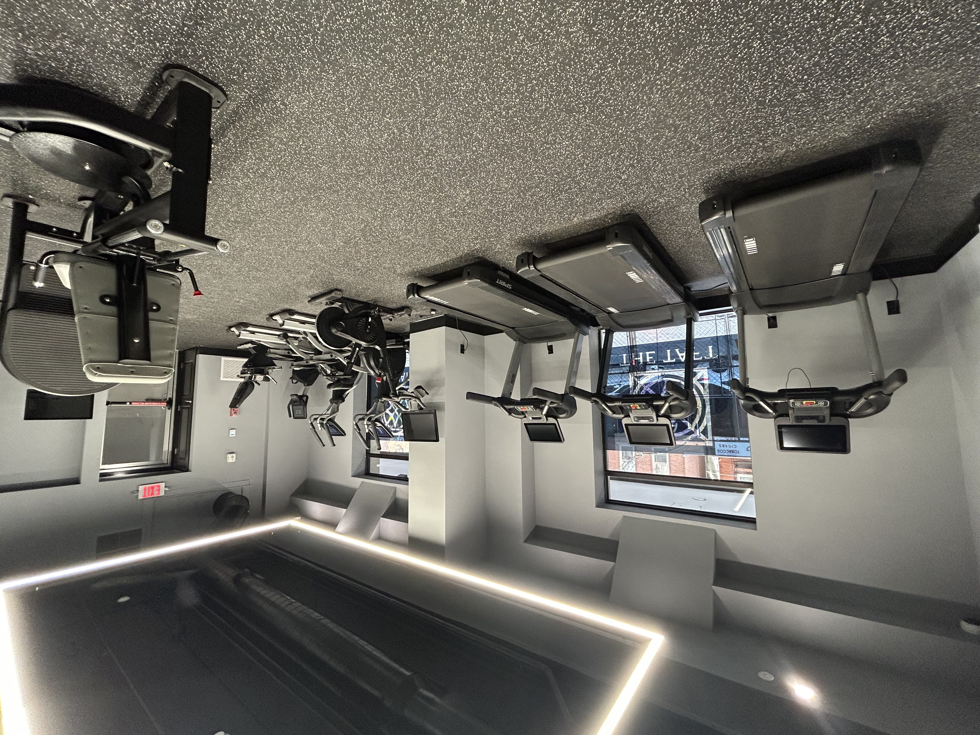 A room with a lot of equipment hanging from the ceiling.