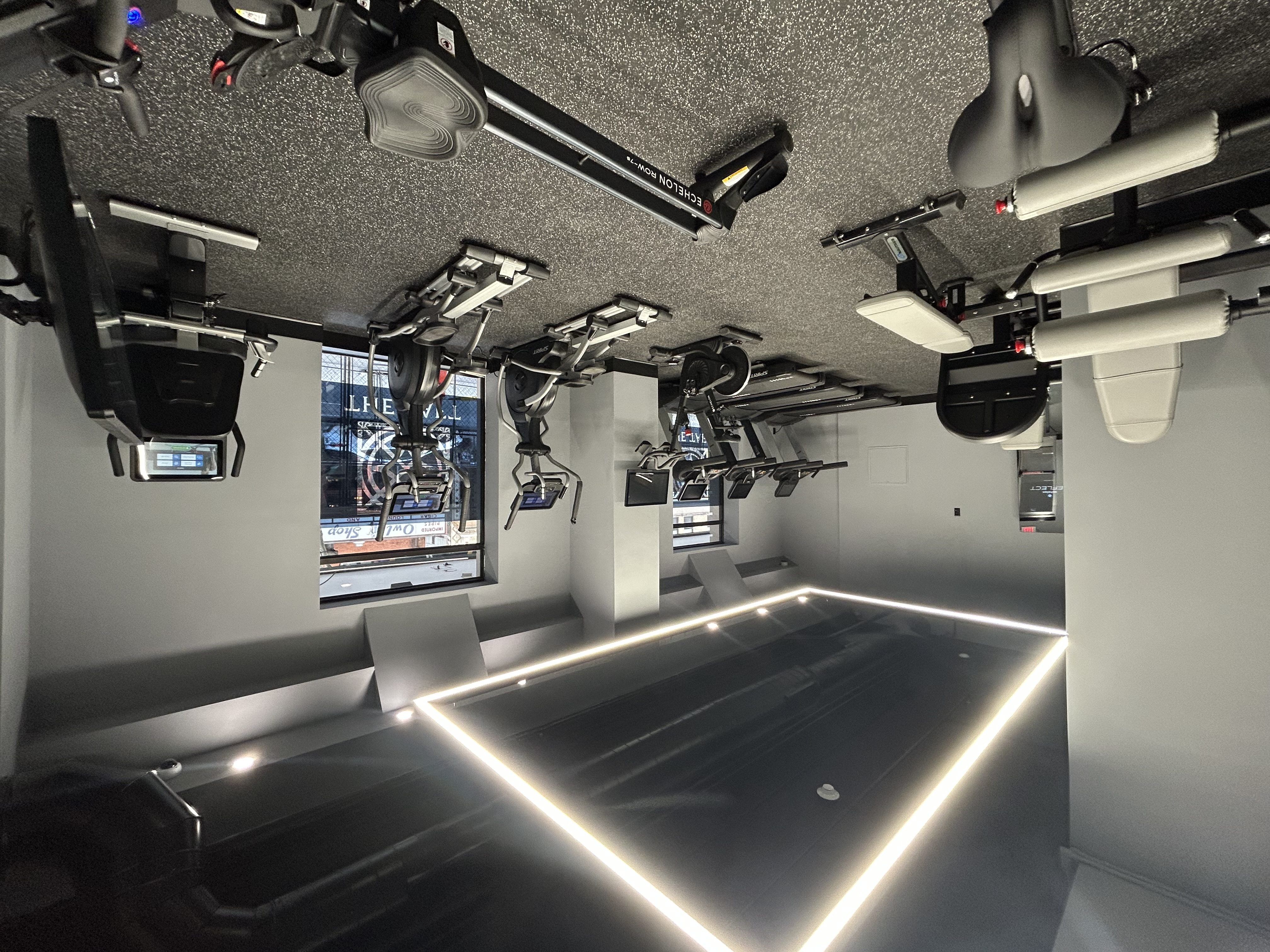 A room with a long table and lights on it.