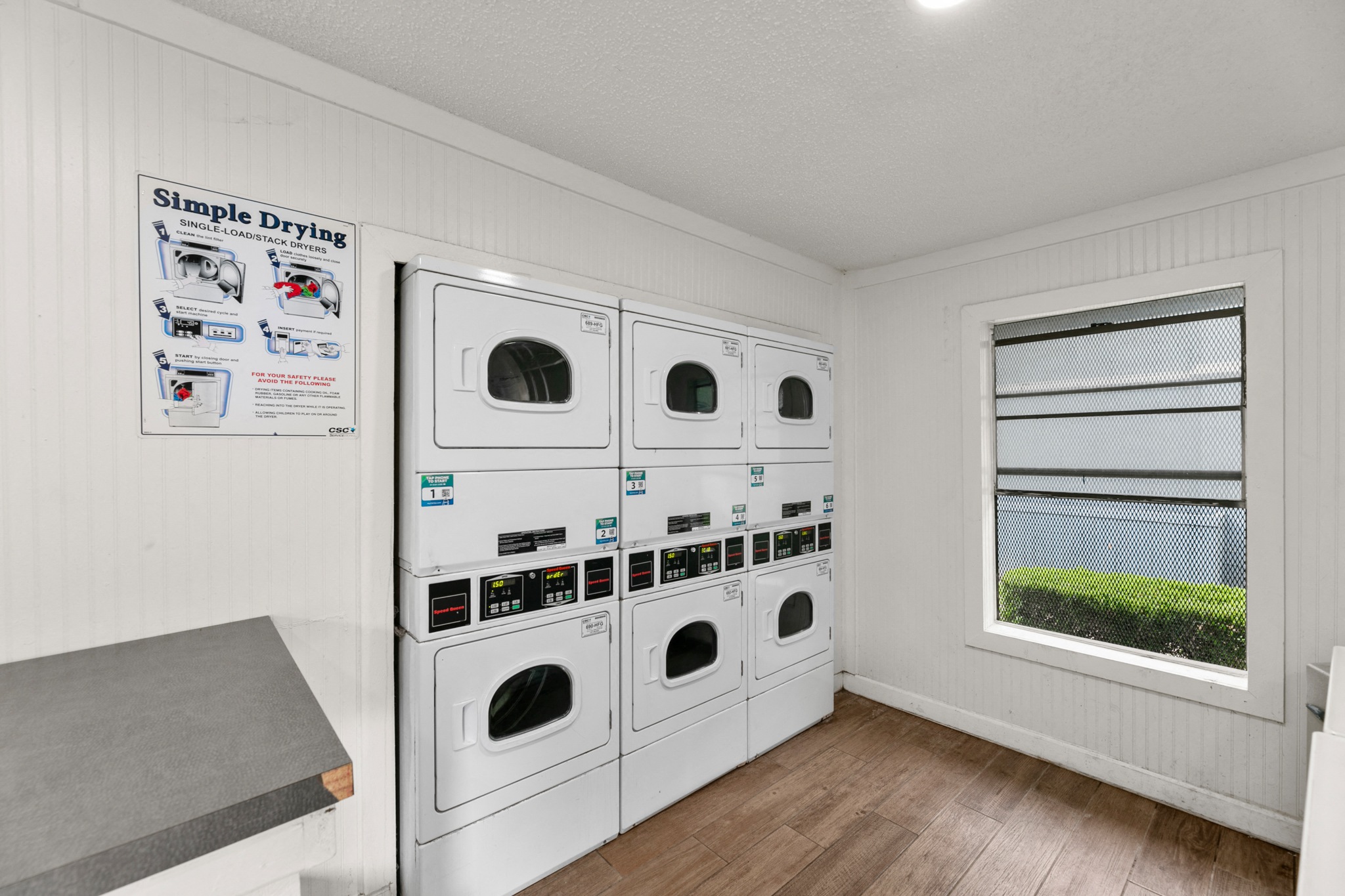 Laundry Room at 5636 Apartment Homes, Texas  75254
