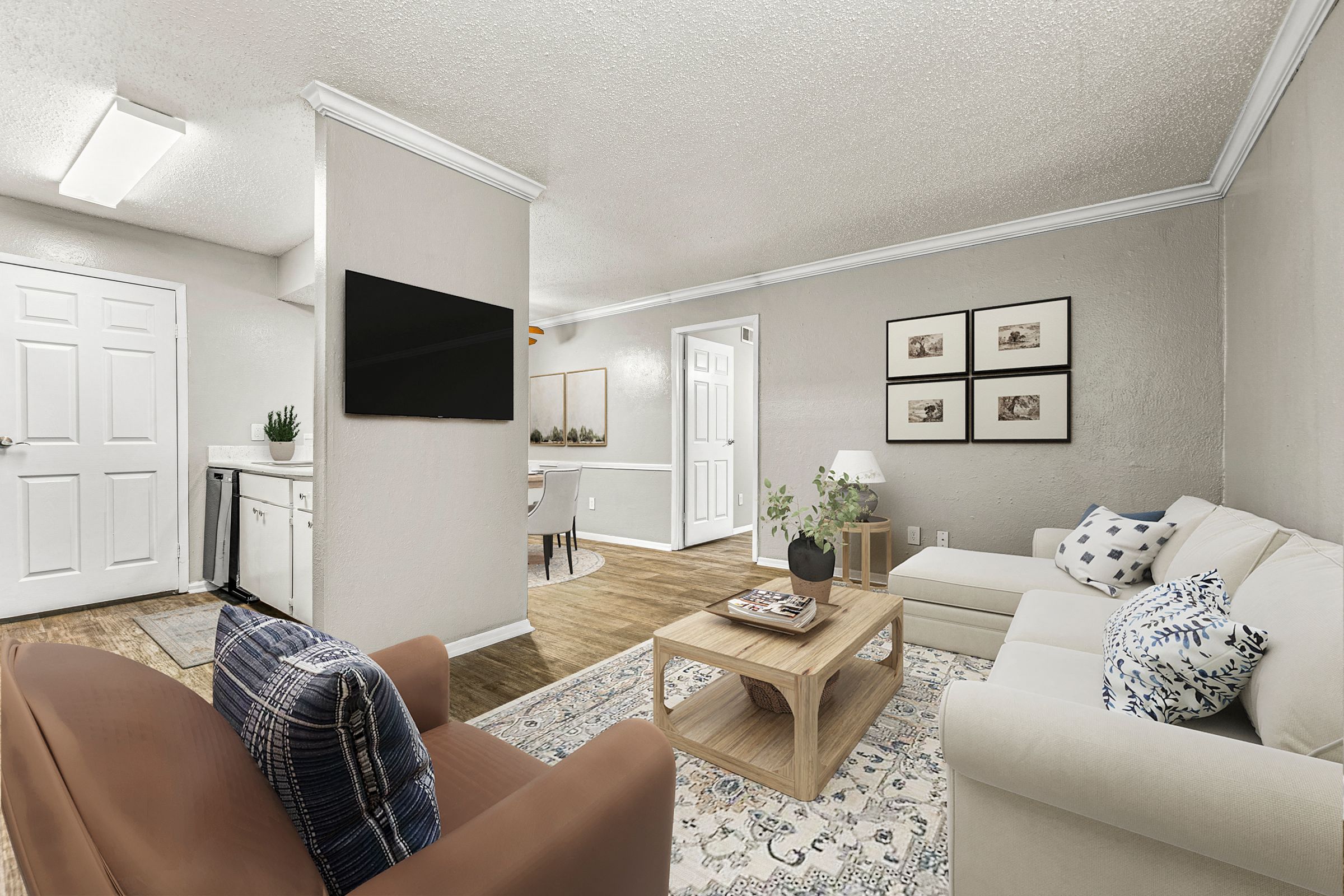 a living room with white furniture and a tv at 5636 Apartment Homes, Texas, 75254