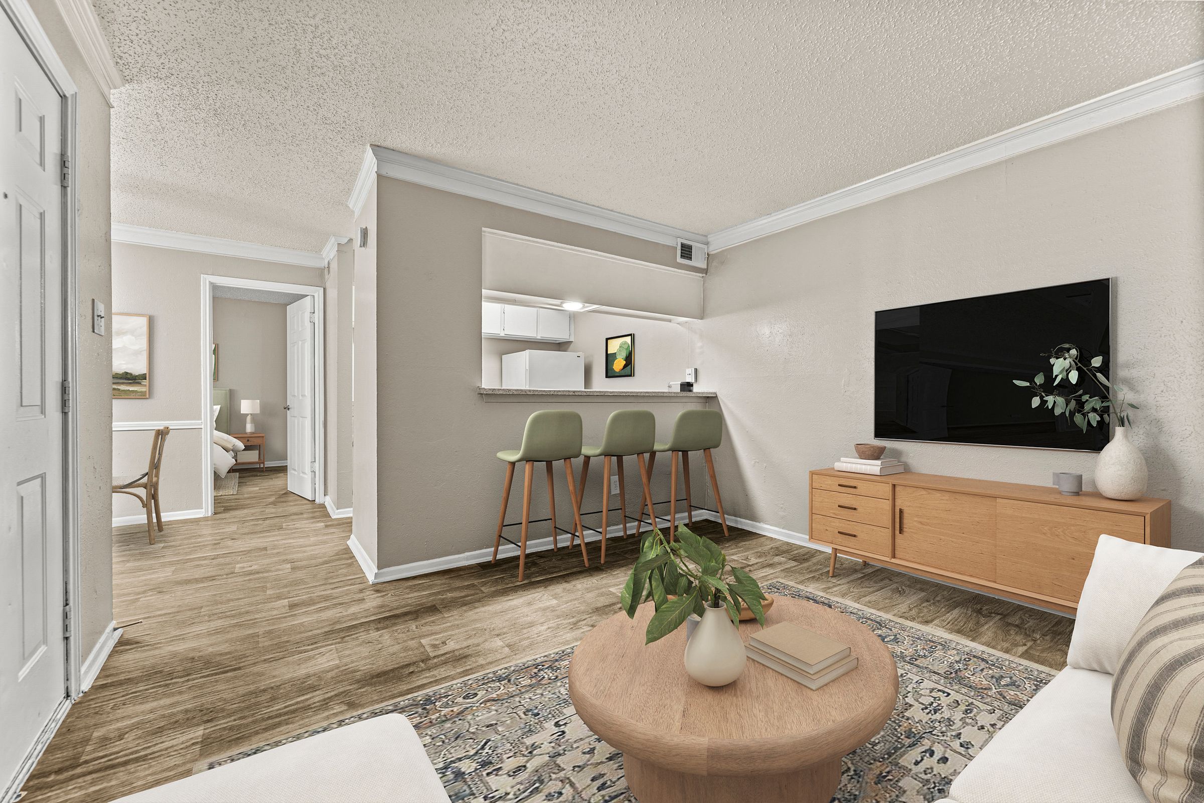 a living room with a couch and a table with chairs at 5636 Apartment Homes, Dallas, 75254