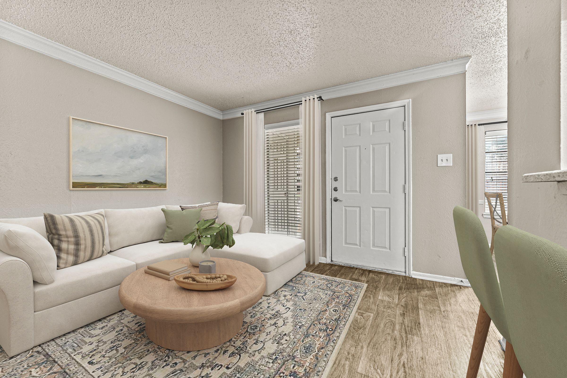 an open living room with a white couch and a table at 5636 Apartment Homes, Texas, 75254