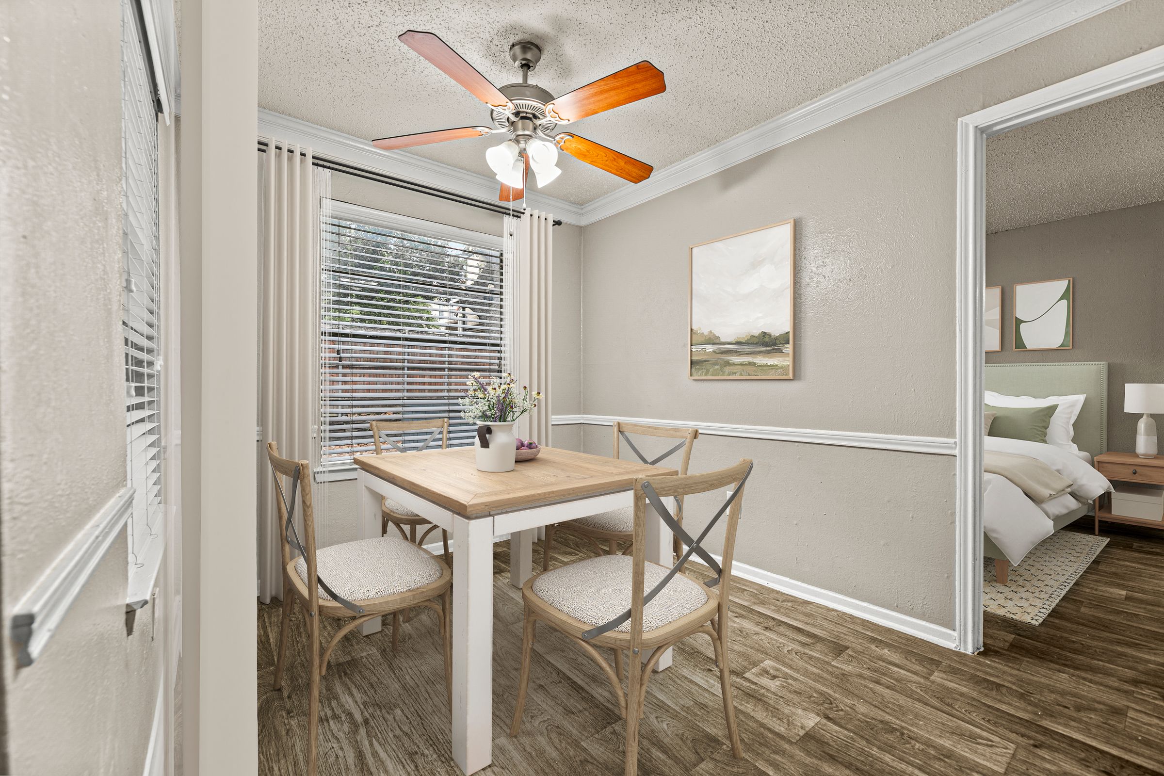 a dining room with a table and chairs and a ceiling fan at 5636 Apartment Homes, Texas, 75254
