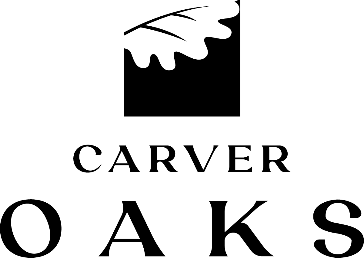 A logo with a black oak leaf on a white background and the words "CARVER OAKS" in black.