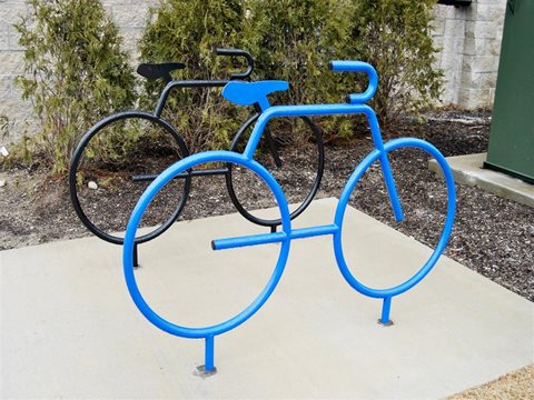 a blue bike rack with two bikes on it at The George, Michigan, 48104