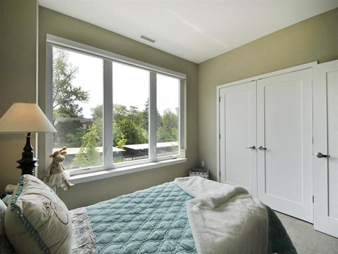a bedroom with a large window and a bed at The George, Michigan