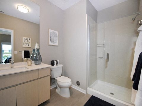 a bathroom with a toilet sink and shower at The George, Ann Arbor