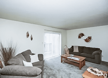 a living room with two couches and a coffee table at Gatehouse Apartments, Missouri, 64134