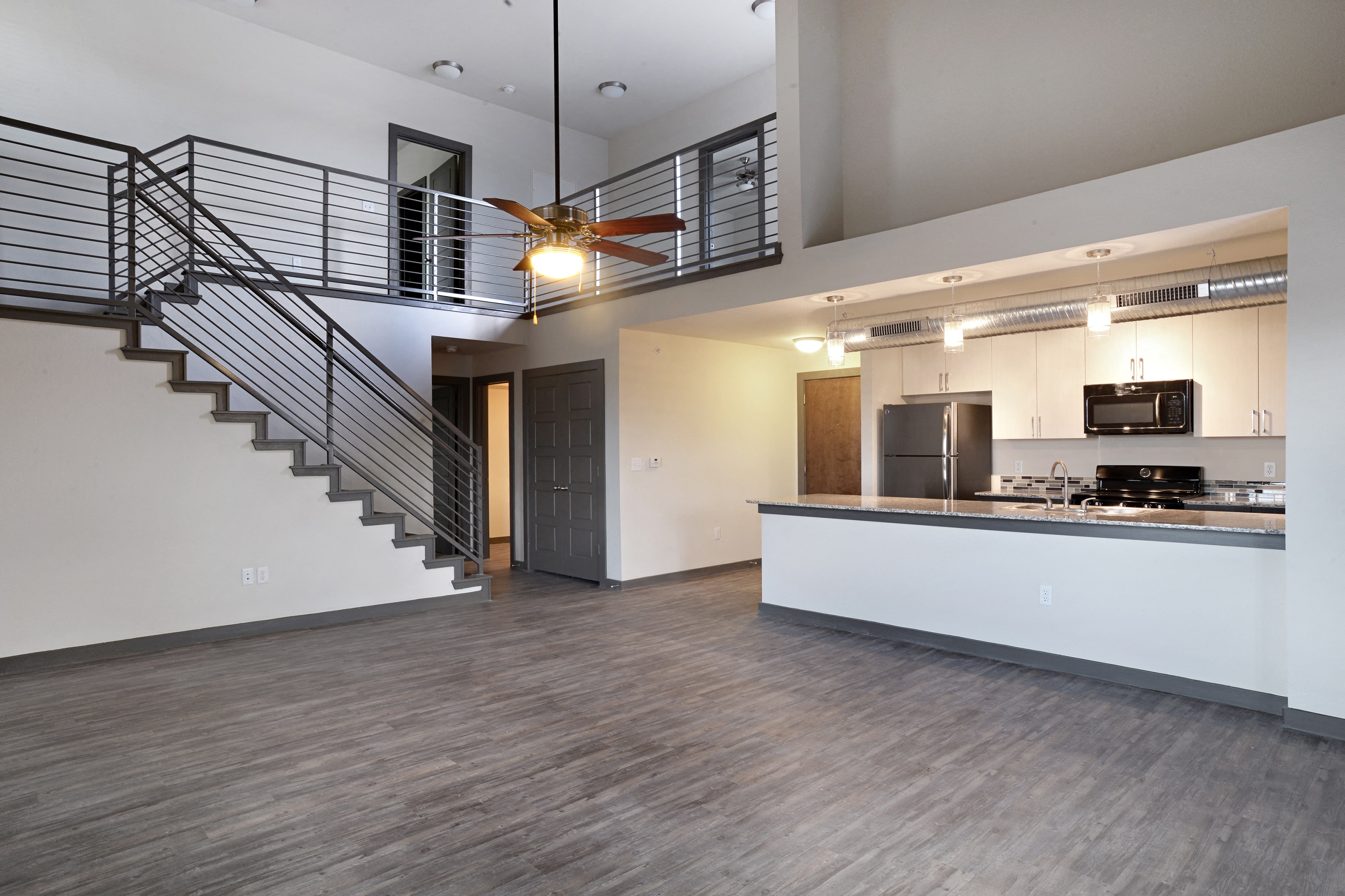 Kitchen and Living at East End Lofts at the Railyard Apartments, Texas, 76201
