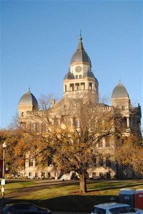 a large building with a tree in front of it