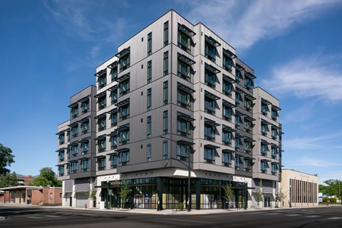 A large, modern building with many windows and balconies.