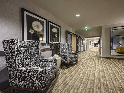 Passage with sofas and wall frames at The Oaks at Paso Robles, Paso Robles, 93446