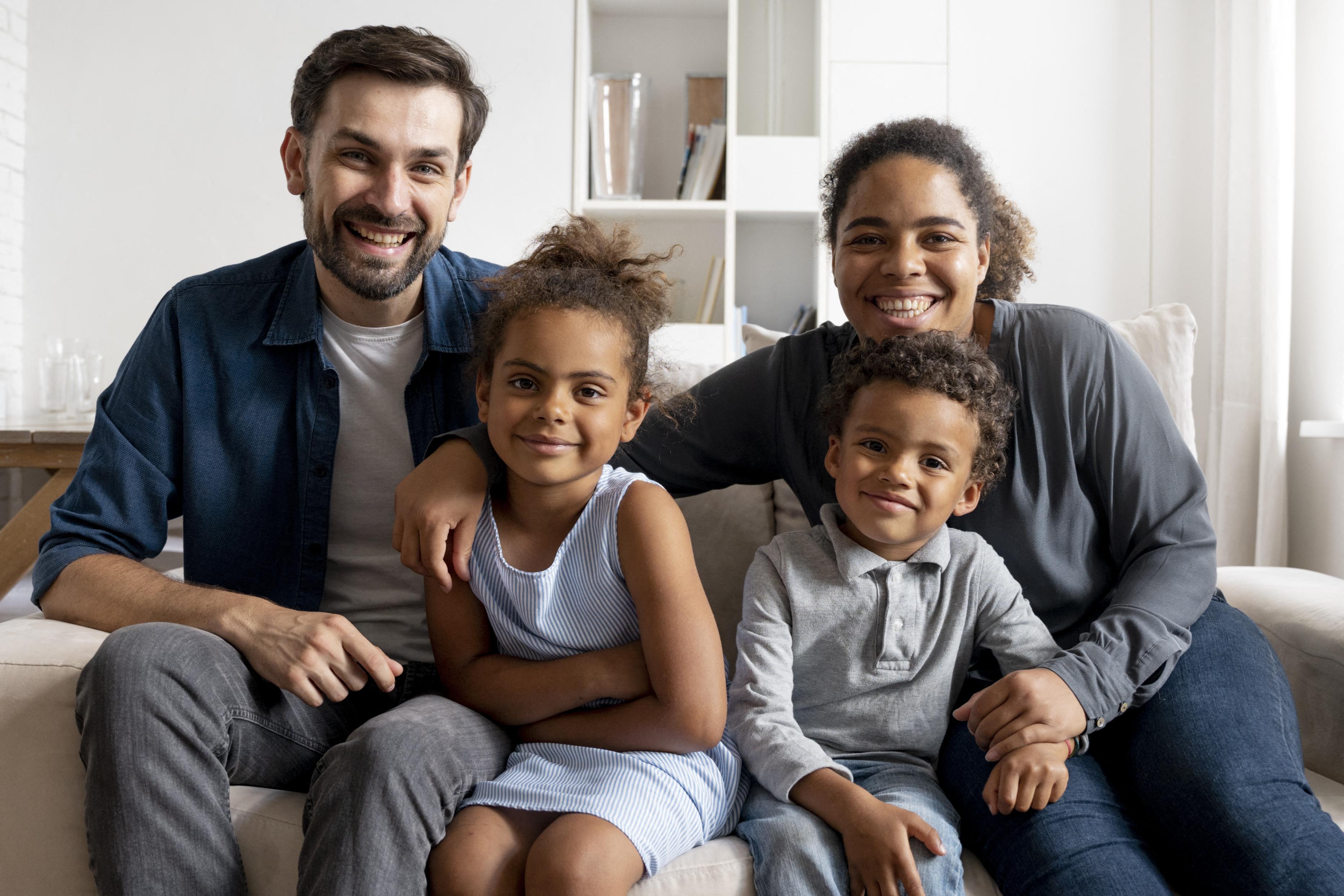 a family sitting on a couch