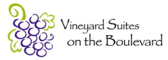 a drawing of a bunch of grapes with the words vineyard suites on the boulevard