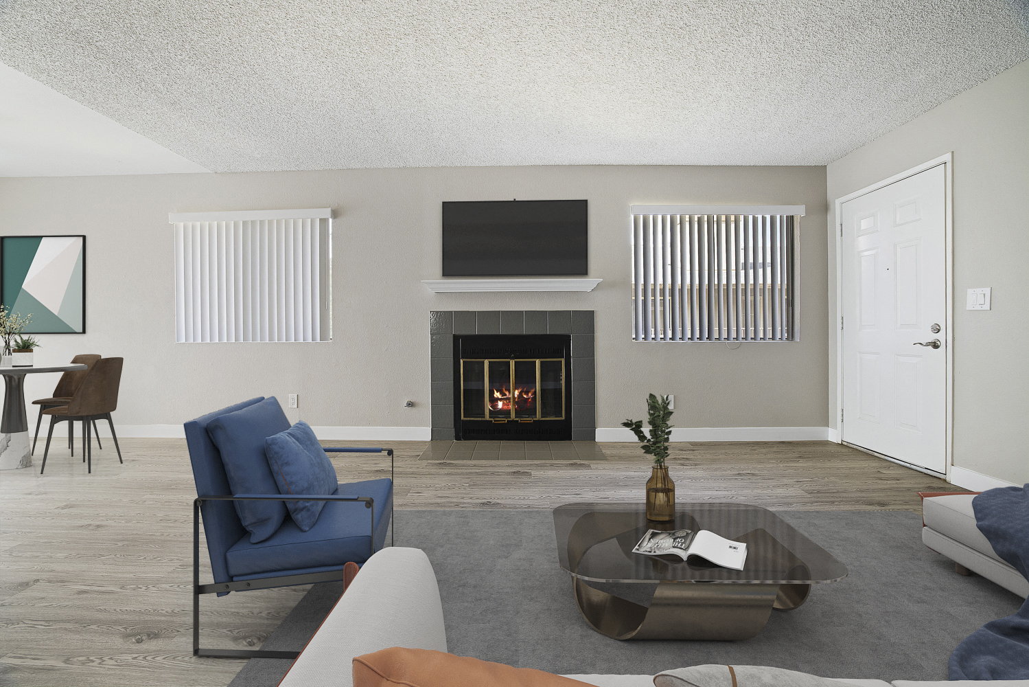 A living room with a fireplace and a television.