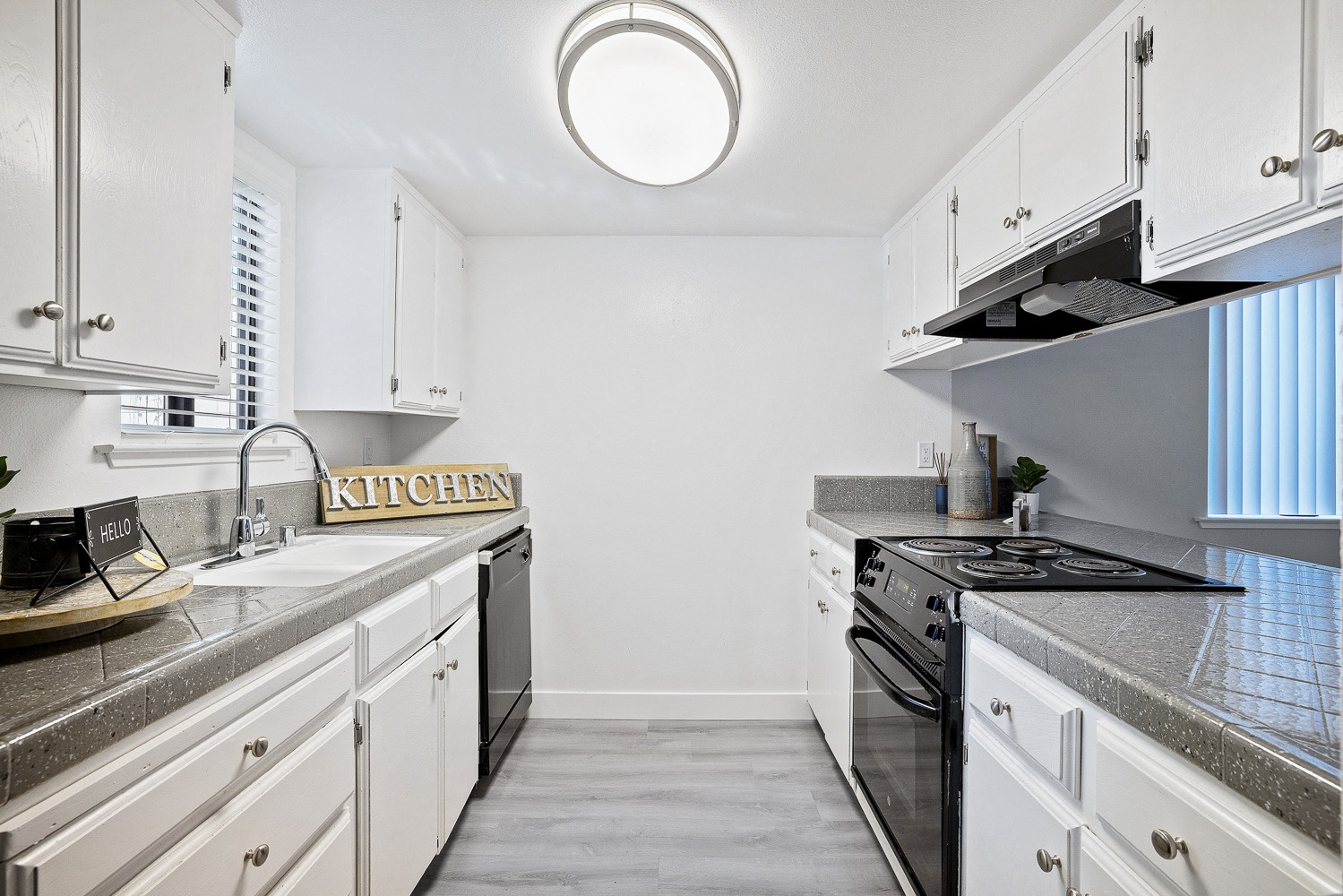 A kitchen with a sign that says