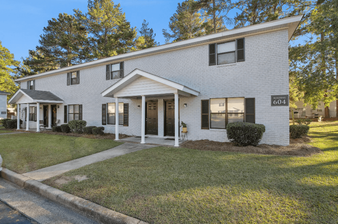 A white house with the number 604 on the front.