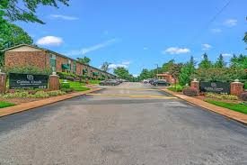 A street view of a residential area with houses on both sides.