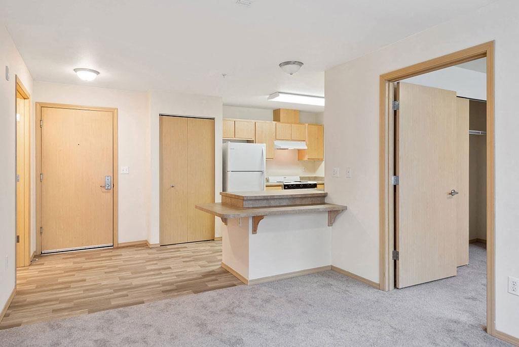 Living area and kitchen at Cedar Park Apartments in Seattle WA