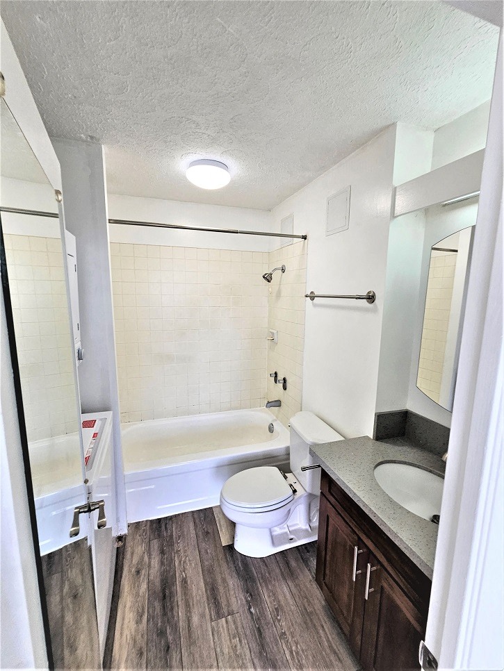 a bathroom with a toilet sink and bathtub