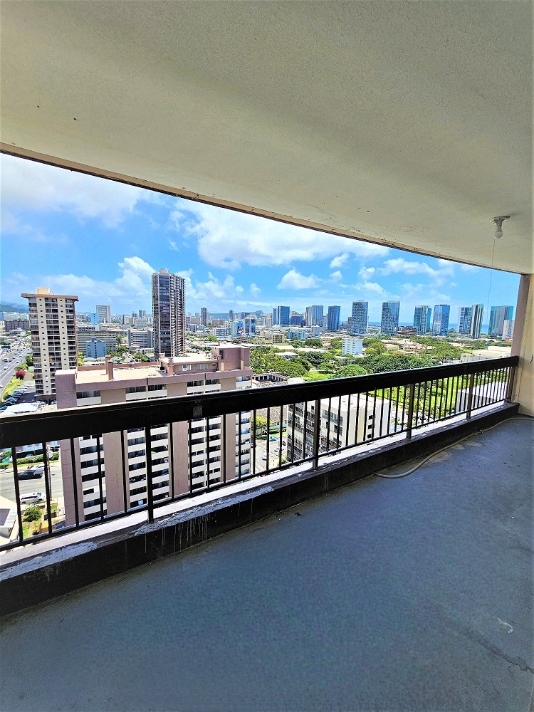 a balcony with a view of the city